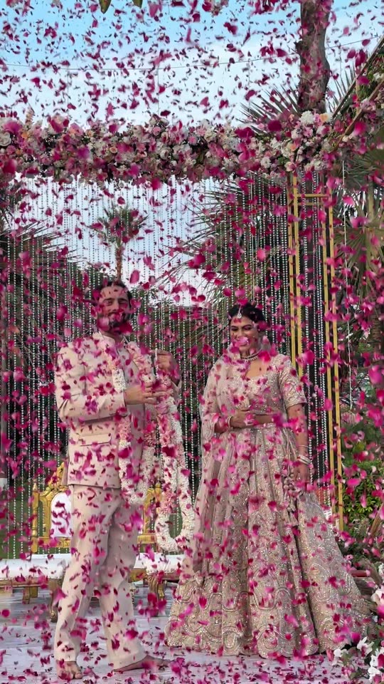 Petals falling during a varmala ceremony