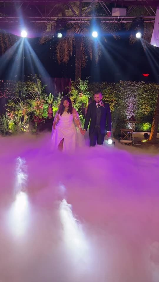 Couple dancing on a bed of low fog