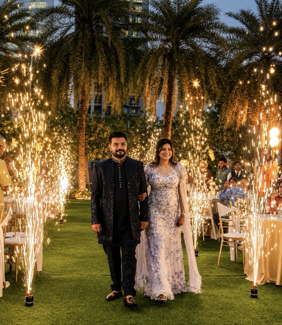Cold-spark fountains lining a wedding aisle